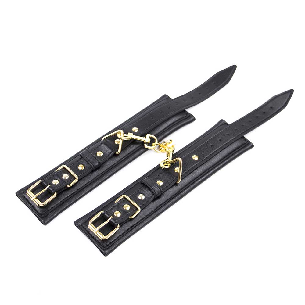 Be Bondage Entraves Poignets Cuir Noir et Métal Doré Réglables BDSM Vue De haut à Plat