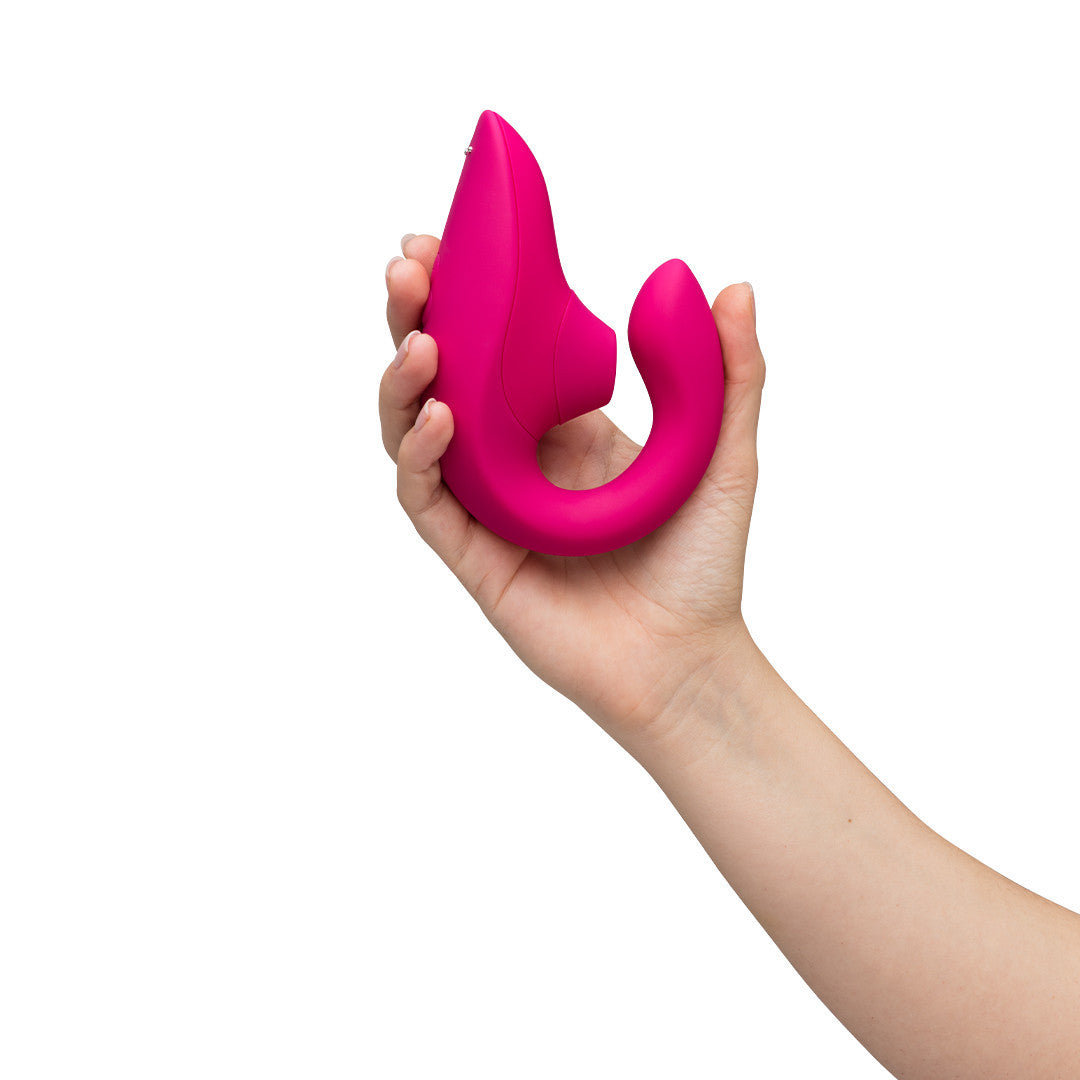 Vibromasseur Rabbit Blend Fushia dans une main
