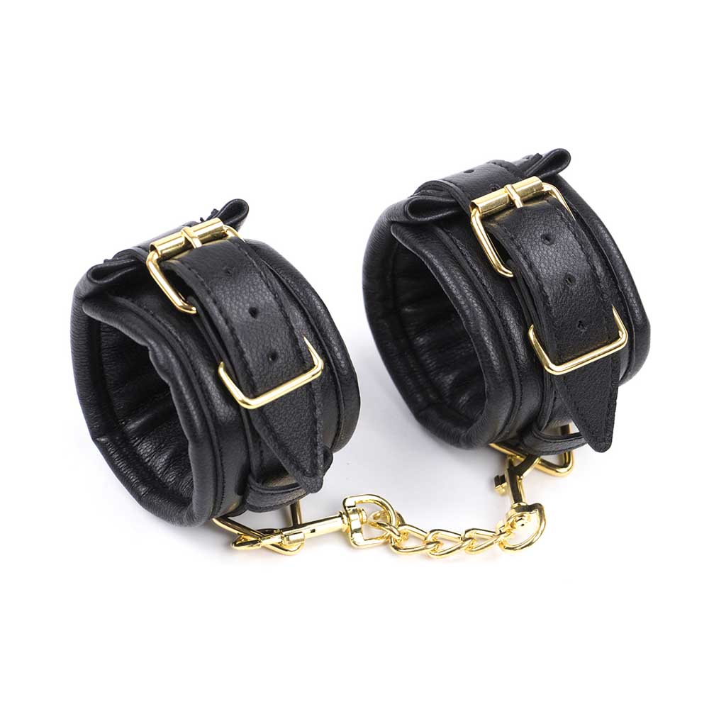 Be Bondage Entraves Poignets Cuir Noir et Métal Doré Réglables BDSM Vue de Profil Attachées