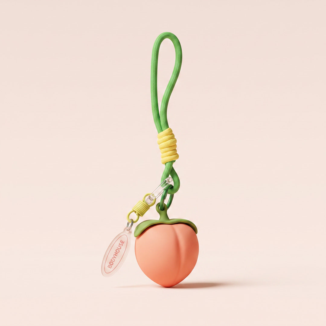 porte-clé en forme de pêche vibrante et rechargeable